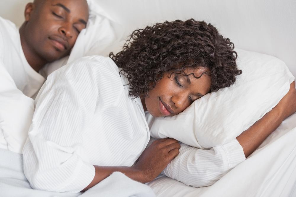 couple sleeping soundly in bed | sleep apnea marysville wa