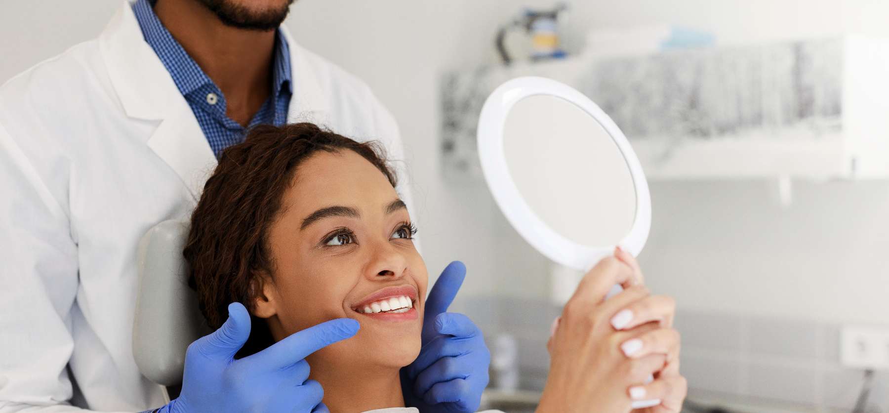 woman looking in mirror at dentist office | botox treatment marysville wa