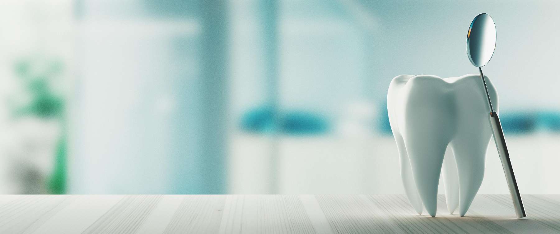 A tooth model and a dental mirror | marysville dental clinic