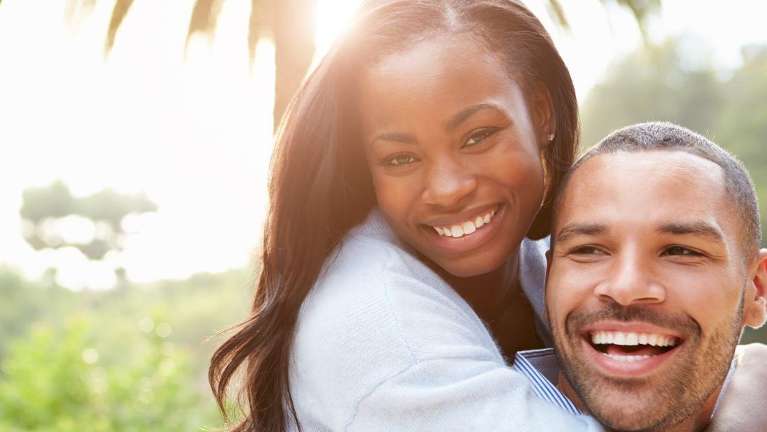 A couple hugging in the park | dentist Marysville WA