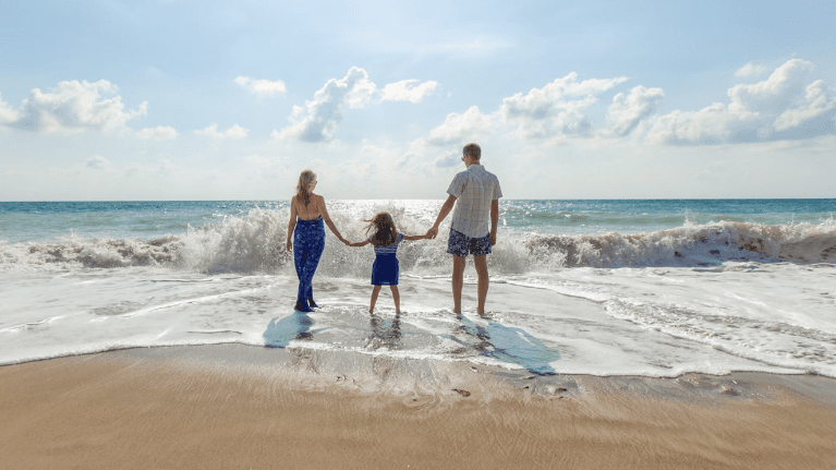 family of three on beach | general dentist marysville wa