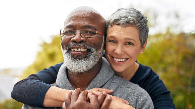 A smiling couple in the park