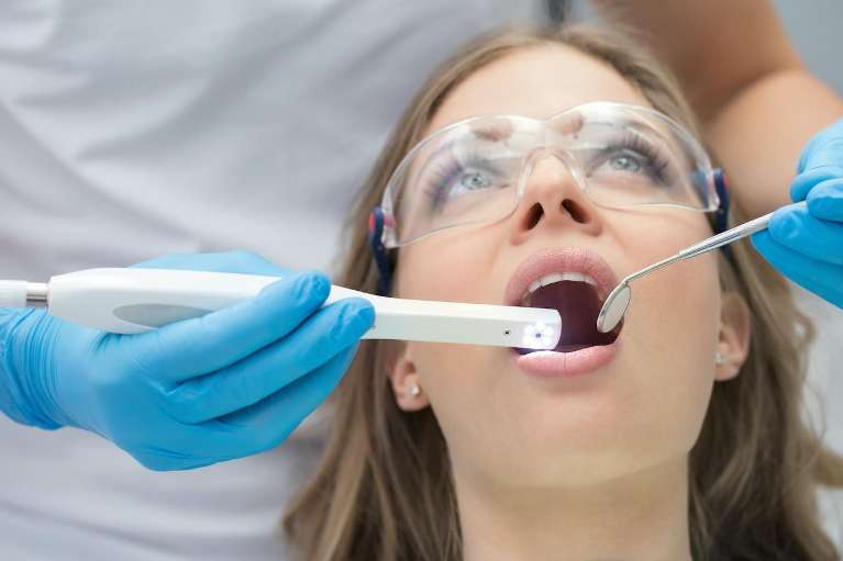 patient receiving dentist exam | marysville dental clinic