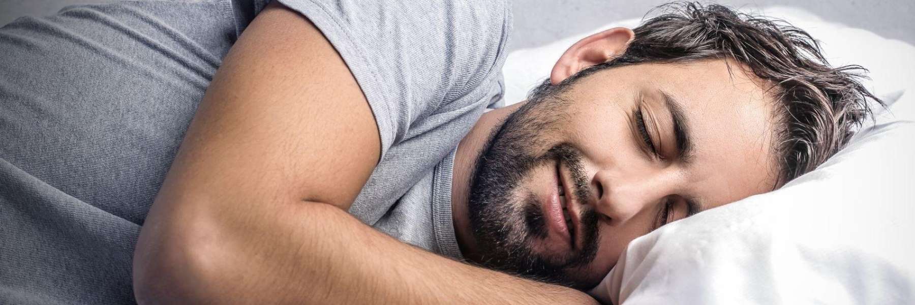 A smiling man sleeping | mandibular advancement device Marysville, WA