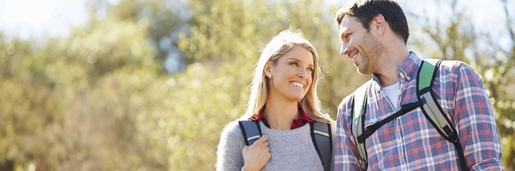 A couple hiking in the park | cosmetic dentist Marysville