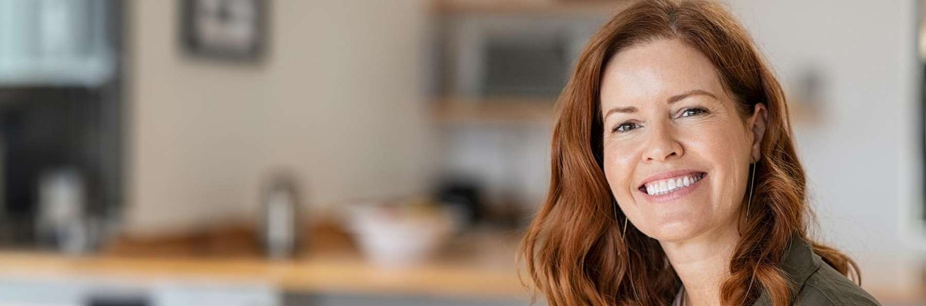 A smiling woman with cosmetic dentistry treatments in Marysville